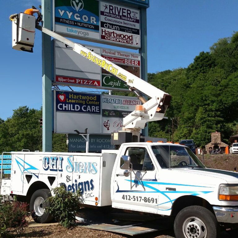 Seth in the bucket truck working high up.